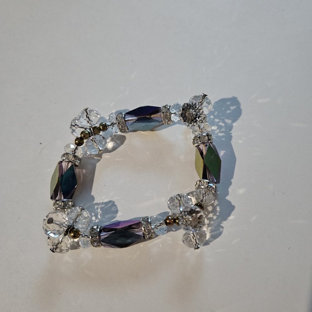 Iridescent and clear beaded stretchable bracelet.  7".